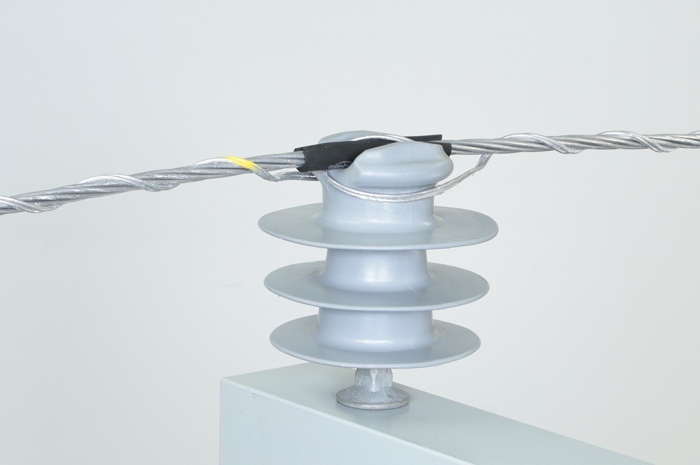Distribution top ties hold conductors  to maintain the required clearance from structures